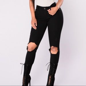 Black jeans with open knees